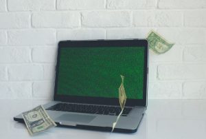 Laptop with bills