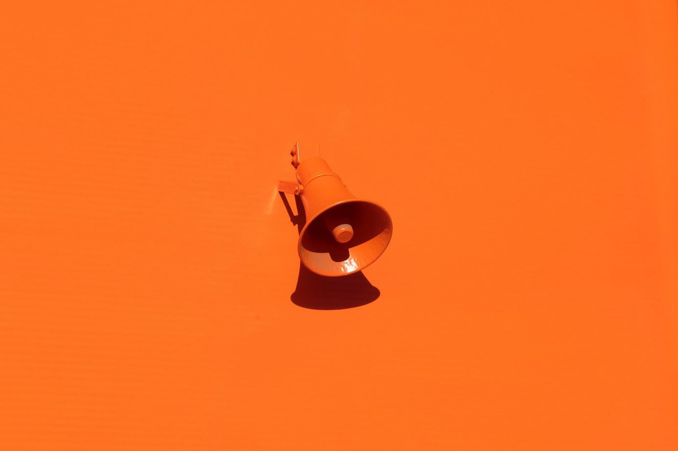 Orange wall and megaphone