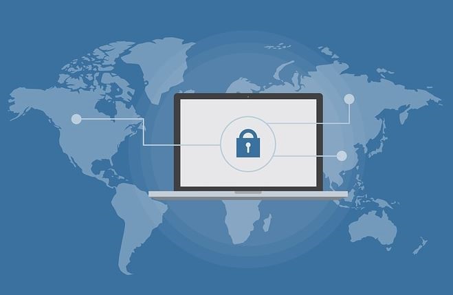 World map and locked laptop