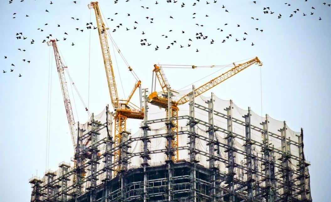 Crane machine on top of building under construction