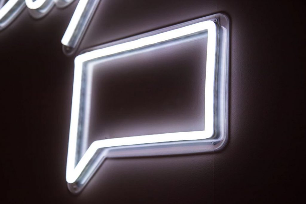 White neon comment sign