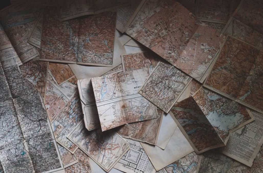 Maps spread out on a desk